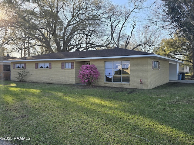 1519 Anderson St, New Iberia, LA 70560 - back of property featuring brick siding and a lawn