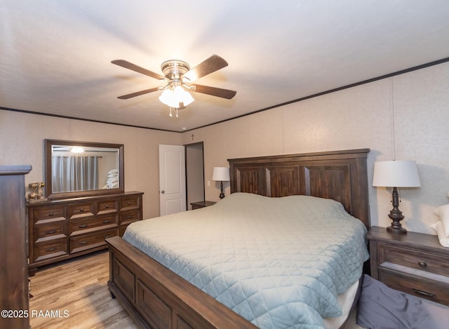 bedroom with light wood-style flooring and a ceiling fan