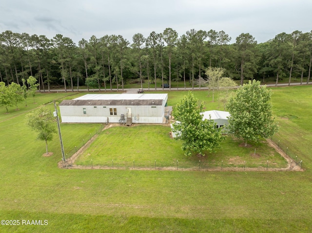 birds eye view of property featuring a wooded view