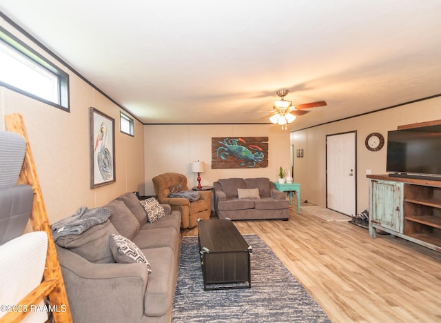 living area featuring wood finished floors and ceiling fan