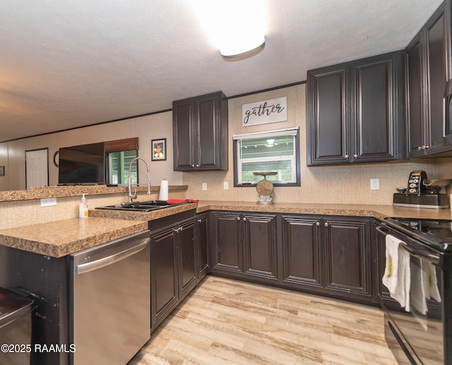 kitchen with dishwasher, a sink, a peninsula, light wood-type flooring, and electric range