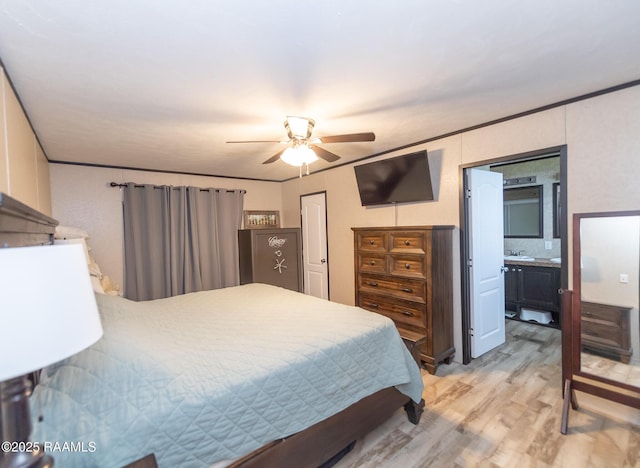 bedroom with a ceiling fan and light wood-style floors