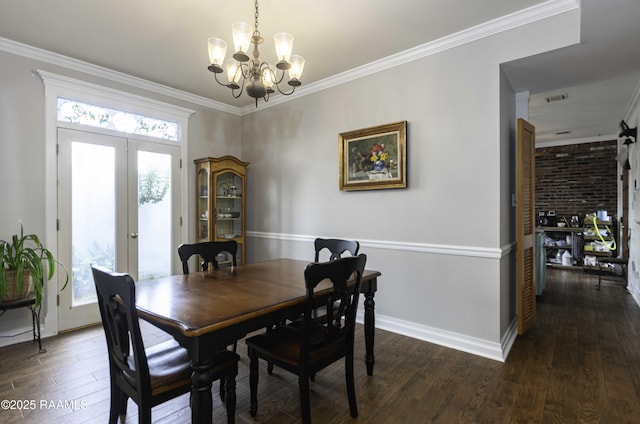 211 Ursuline St, Lafayette, LA 70506 - dining room with a chandelier, dark wood-style floors, french doors, and crown molding