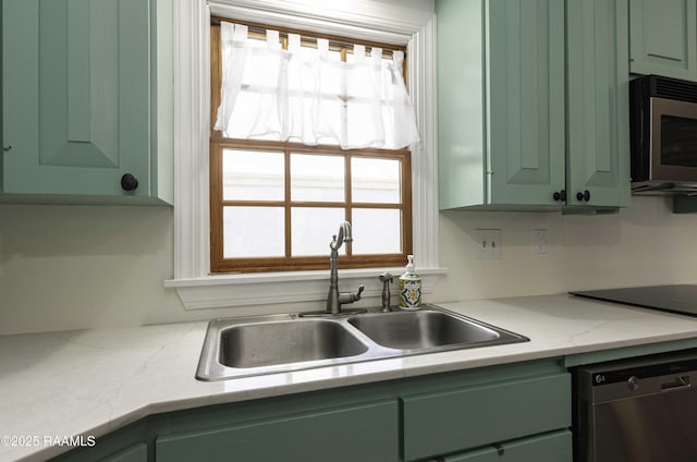 211 Ursuline St, Lafayette, LA 70506 - kitchen featuring appliances with stainless steel finishes and green cabinets