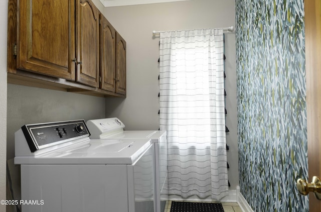 211 Ursuline St, Lafayette, LA 70506 - laundry room featuring washing machine and dryer and cabinet space