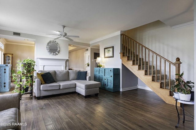 211 Ursuline St, Lafayette, LA 70506 - living area featuring stairway, wood finished floors, crown molding, and a ceiling fan