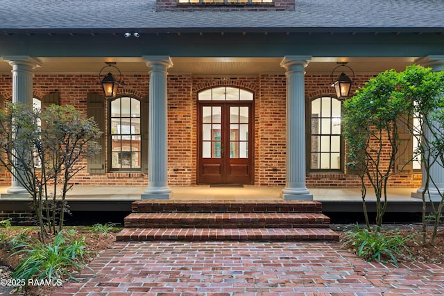 110 Interlaken Dr, New Iberia, LA 70563 - entrance to property with a porch, a shingled roof, and brick siding