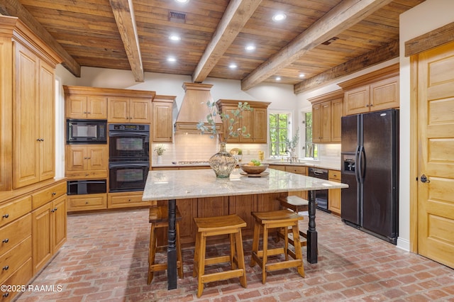 110 Interlaken Dr, New Iberia, LA 70563 - kitchen featuring black appliances, wooden ceiling, a warming drawer, brick flooring, and a breakfast bar