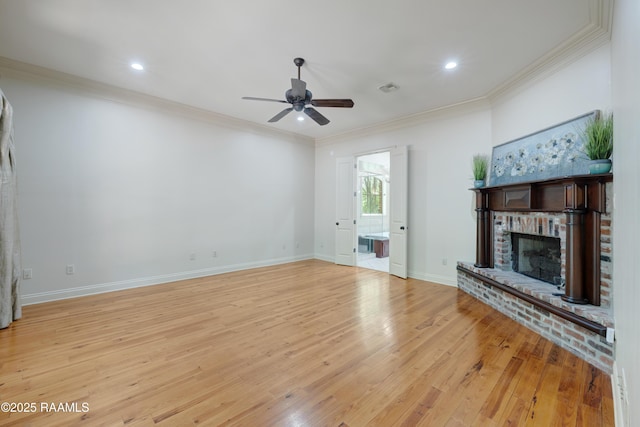 110 Interlaken Dr, New Iberia, LA 70563 - unfurnished living room with a brick fireplace, a ceiling fan, light wood-style floors, crown molding, and baseboards