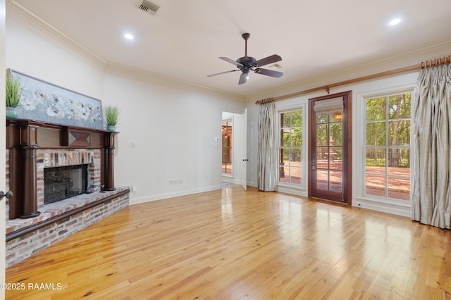 110 Interlaken Dr, New Iberia, LA 70563 - unfurnished living room featuring ceiling fan, wood finished floors, a fireplace, baseboards, and ornamental molding