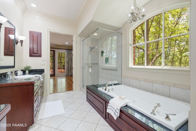 110 Interlaken Dr, New Iberia, LA 70563 - bathroom featuring plenty of natural light, tile patterned flooring, a shower stall, a whirlpool tub, and ornamental molding