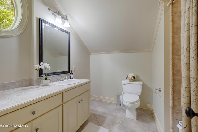110 Interlaken Dr, New Iberia, LA 70563 - bathroom with toilet, tile patterned floors, vanity, vaulted ceiling, and ornamental molding