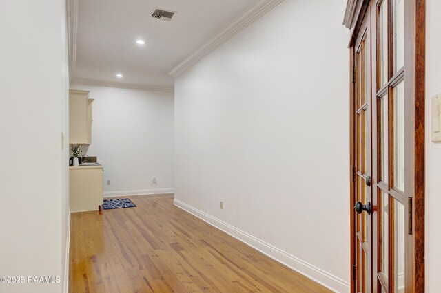 110 Interlaken Dr, New Iberia, LA 70563 - spare room featuring light wood-type flooring, crown molding, recessed lighting, and baseboards