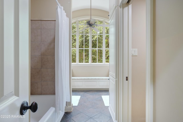 110 Interlaken Dr, New Iberia, LA 70563 - full bath featuring a ceiling fan, healthy amount of natural light, and shower / tub combo