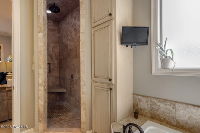 full bathroom with a bath and tiled shower