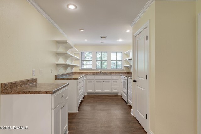 kitchen featuring white cabinetry, open shelves, white electric range oven, and visible vents