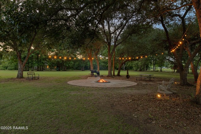 view of yard with an outdoor fire pit