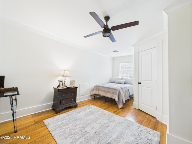 544 E Main St, New Iberia, LA 70560 - bedroom with ornamental molding, wood finished floors, baseboards, and ceiling fan