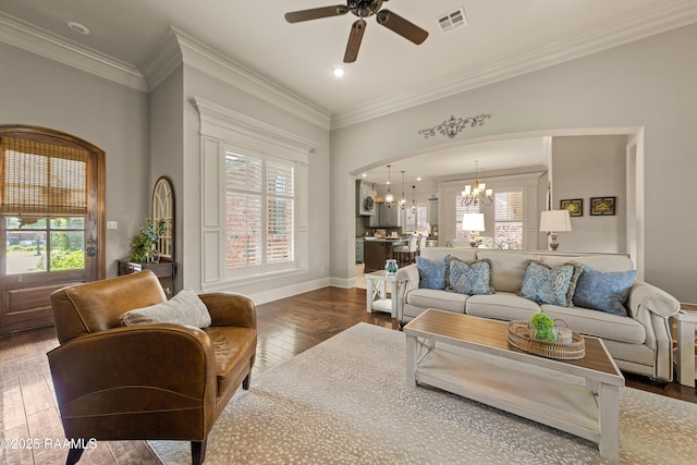 living room with a wealth of natural light, hardwood / wood-style floors, and visible vents