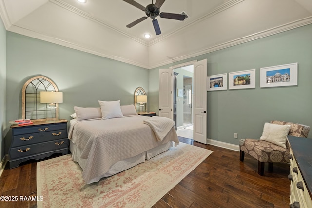 bedroom with a raised ceiling, recessed lighting, baseboards, dark wood-type flooring, and ornamental molding