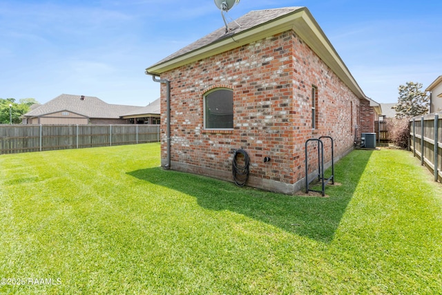 view of outbuilding featuring a fenced backyard and cooling unit