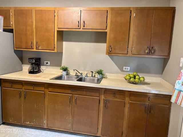 kitchen with a sink and light countertops