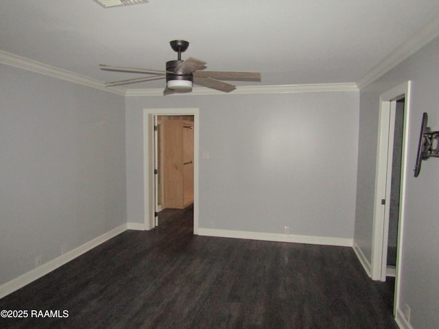 spare room with crown molding, a ceiling fan, and baseboards