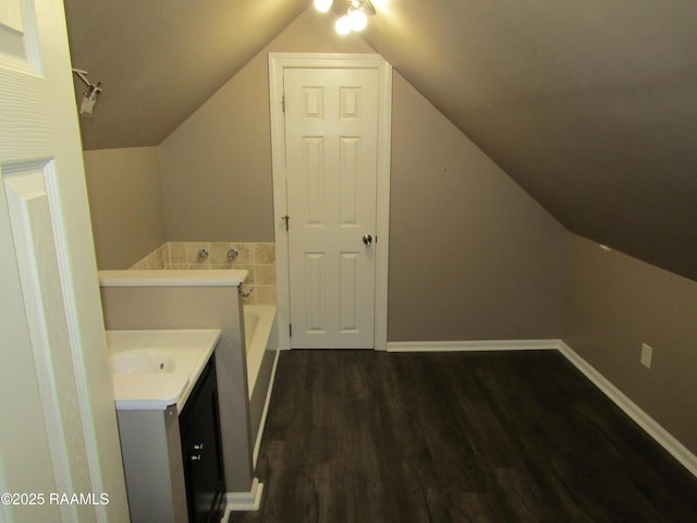 washroom featuring dark wood-type flooring and baseboards