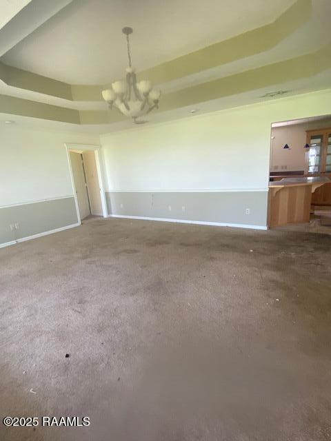 16224 Saint Elmo Rd, Erath, LA 70533 - carpeted spare room featuring baseboards and a chandelier