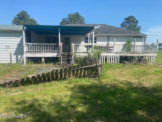 16224 Saint Elmo Rd, Erath, LA 70533 - back of property featuring a yard and a wooden deck
