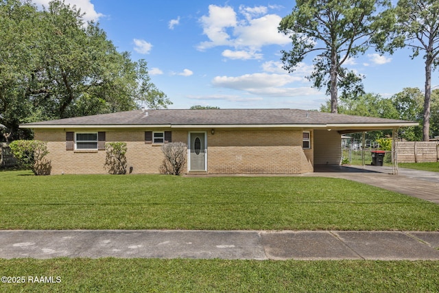 ranch-style home featuring driveway, a front yard, brick siding, fence, and an attached carport