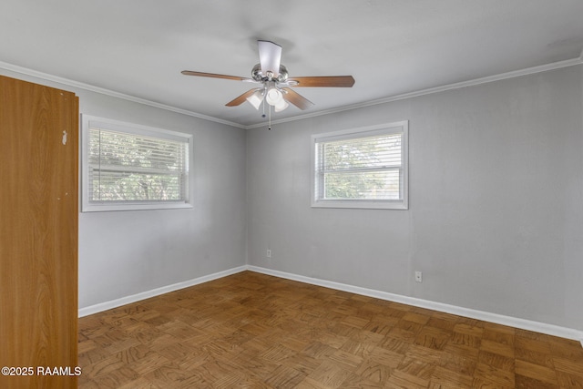 unfurnished room featuring baseboards, a ceiling fan, and a wealth of natural light