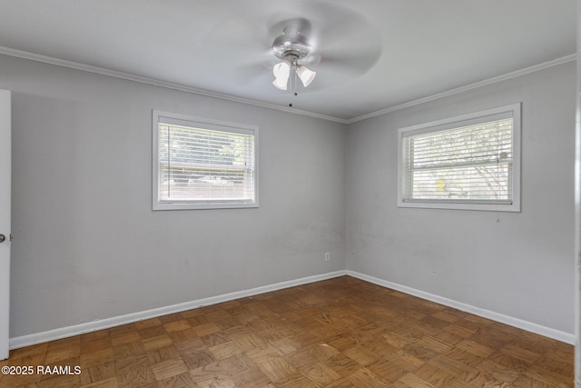 unfurnished room featuring crown molding, baseboards, and ceiling fan