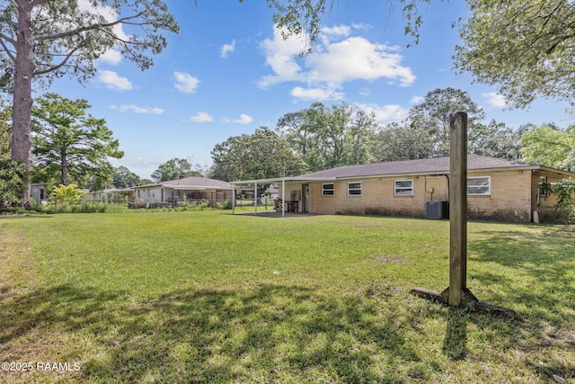 105 Birch Dr, Lafayette, LA 70506 - view of yard featuring cooling unit and a patio area