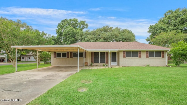 ranch-style house featuring a carport, driveway, brick siding, and a front yard