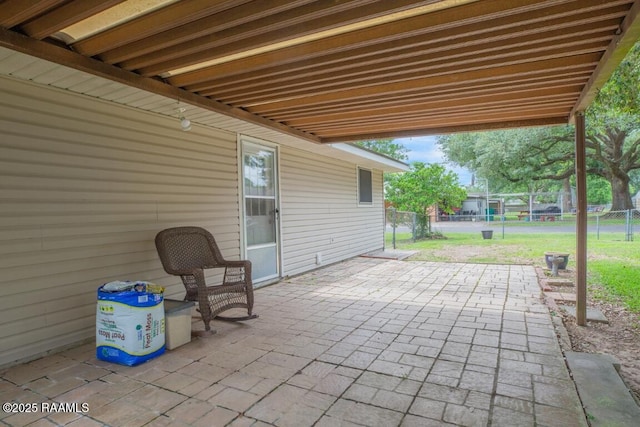 view of patio / terrace featuring fence