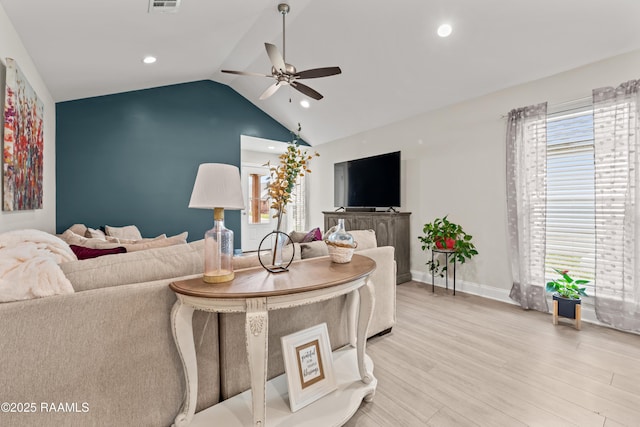 living room featuring ceiling fan, recessed lighting, lofted ceiling, light wood-type flooring, and visible vents