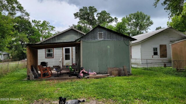 205 F St, Duson, LA 70529 - rear view of house featuring fence and a lawn