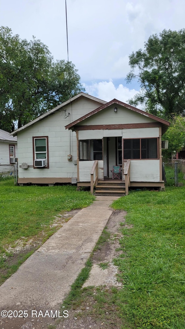 205 F St, Duson, LA 70529 - bungalow-style home featuring cooling unit, a porch, and a front lawn