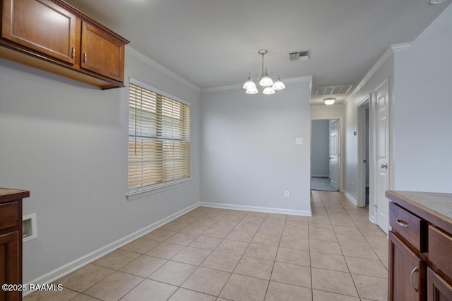 unfurnished dining area featuring visible vents, light tile patterned floors, baseboards, a notable chandelier, and ornamental molding