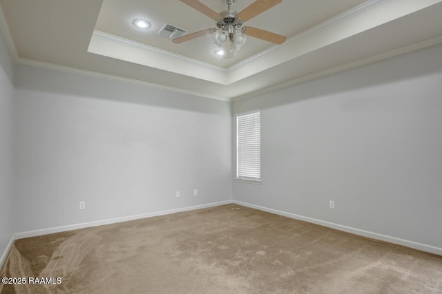 empty room with carpet floors, ceiling fan, and ornamental molding