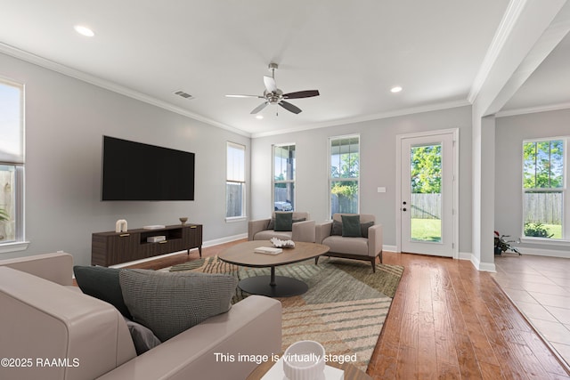 living room featuring recessed lighting, baseboards, ceiling fan, crown molding, and wood-type flooring