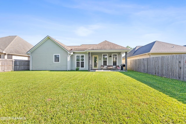 back of property with a patio