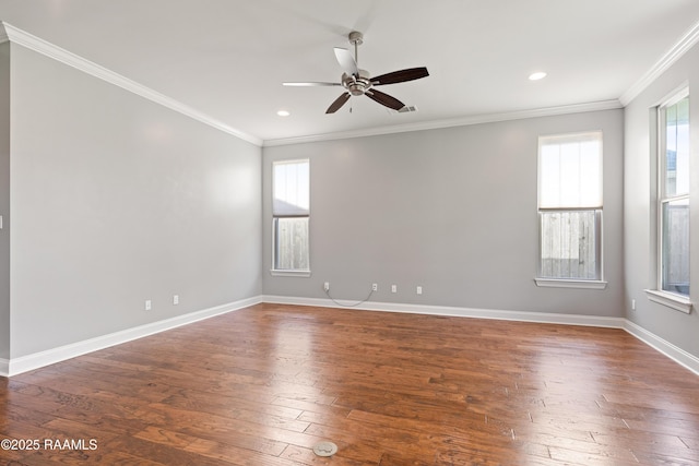 empty room with ceiling fan, wood-type flooring, ornamental molding, recessed lighting, and baseboards