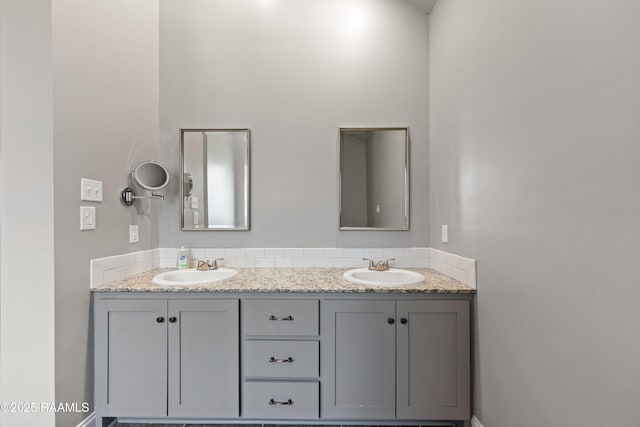 full bathroom featuring double vanity