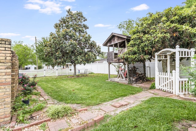 207 S Saint Valerie St, Abbeville, LA 70510 - view of yard with a gate and a fenced backyard