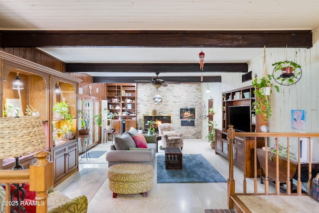 207 S Saint Valerie St, Abbeville, LA 70510 - living area featuring ceiling fan, wooden walls, and beamed ceiling