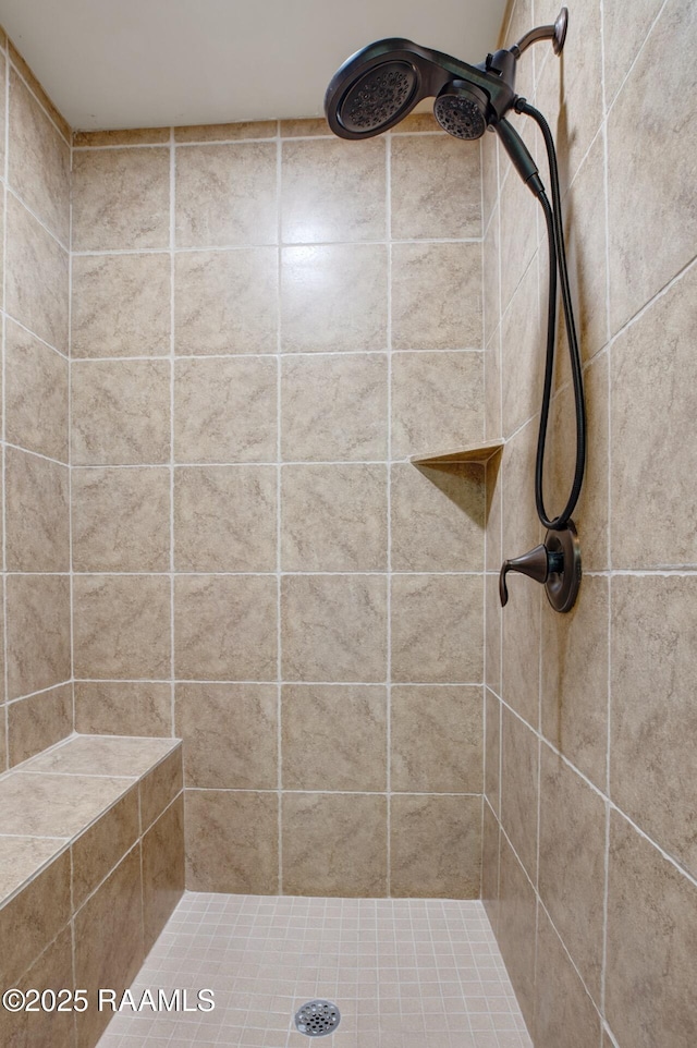 full bath featuring a tile shower