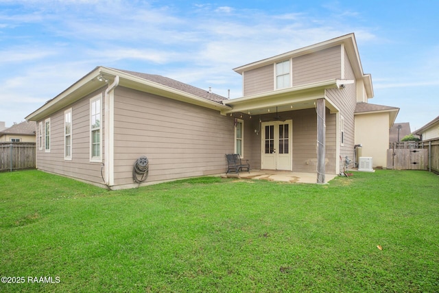 back of house featuring a patio and french doors