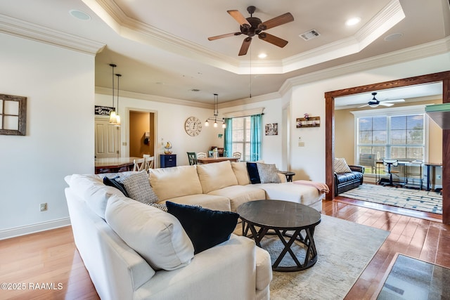 110 Beringer Dr, Duson, LA 70529 - living room with visible vents, a raised ceiling, ceiling fan, and a wealth of natural light